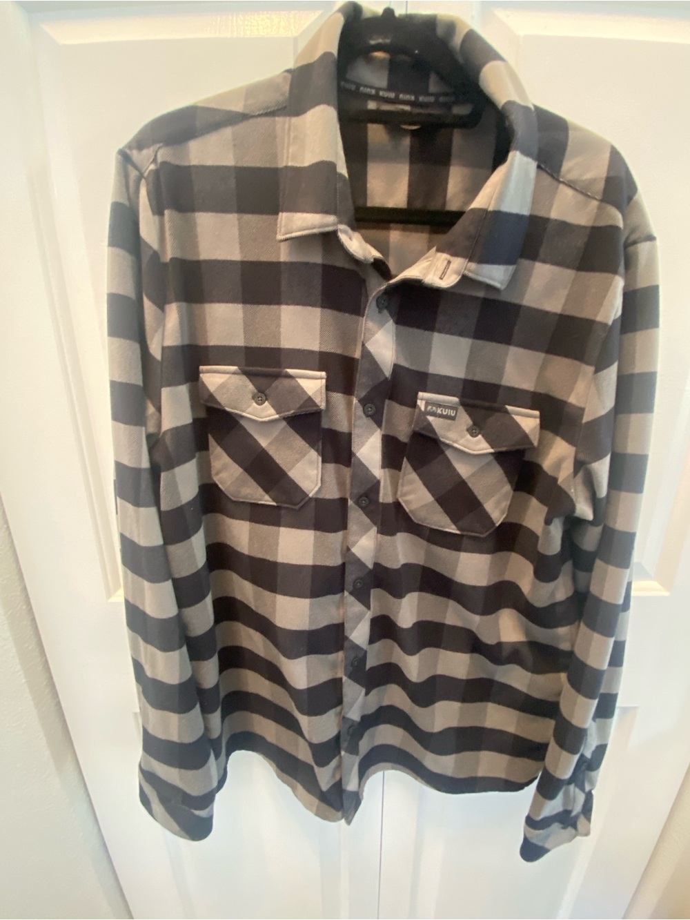 One KUIU Black and Gray Plaid Button-Up Shirt and Blue and Black plaid Button-up